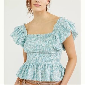 LOVE THE LABEL (Anthropologie) smocked ruffle top light blue floral pattern